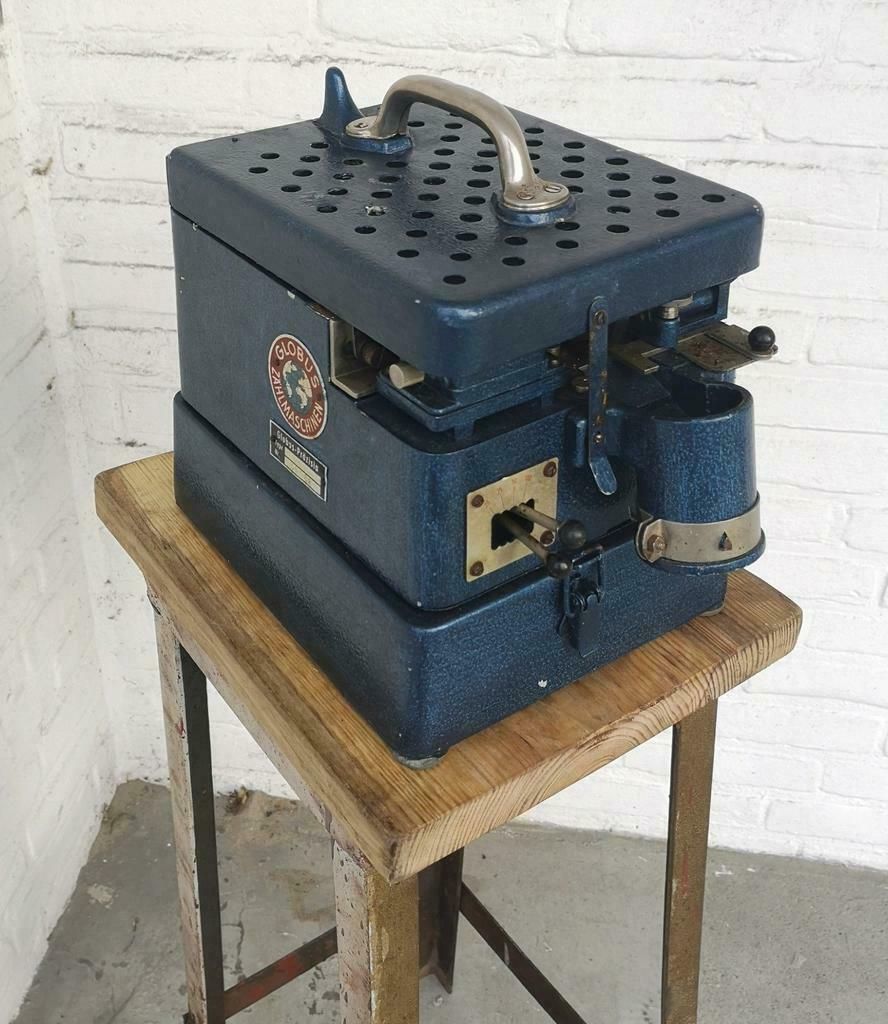 Vintage muntgeld telmachine uit de jaren 50