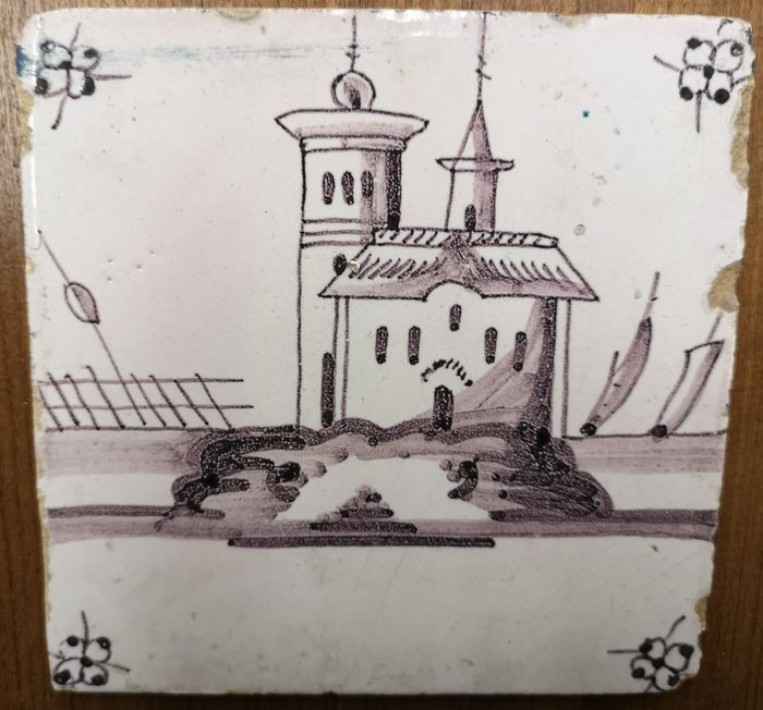 Een antieke tegel afbeelding van een kasteel